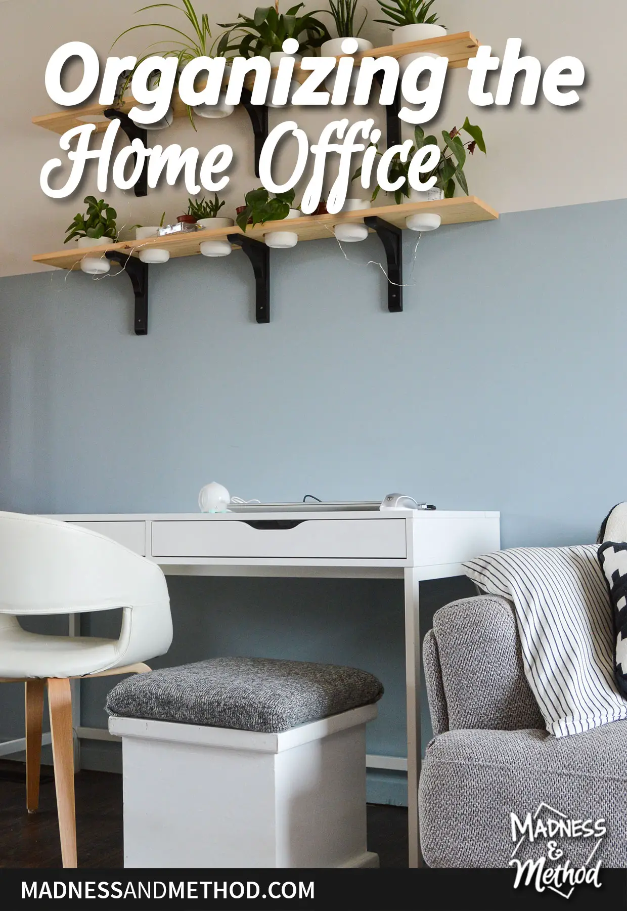 organizing the home office text overlay on blue wall with white desk and chair