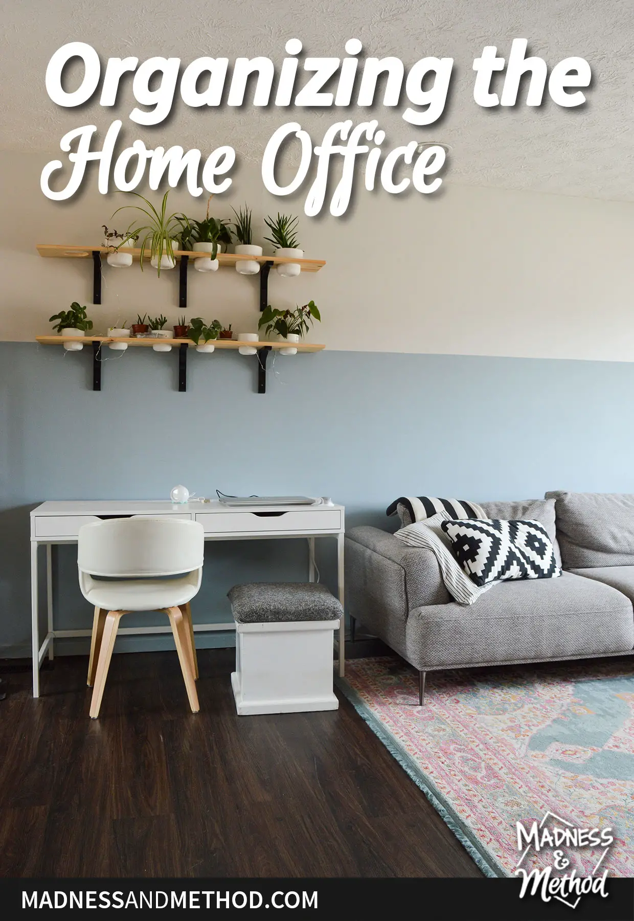 organizing the home office text overlay on blue half wall with white desk and gray sofa