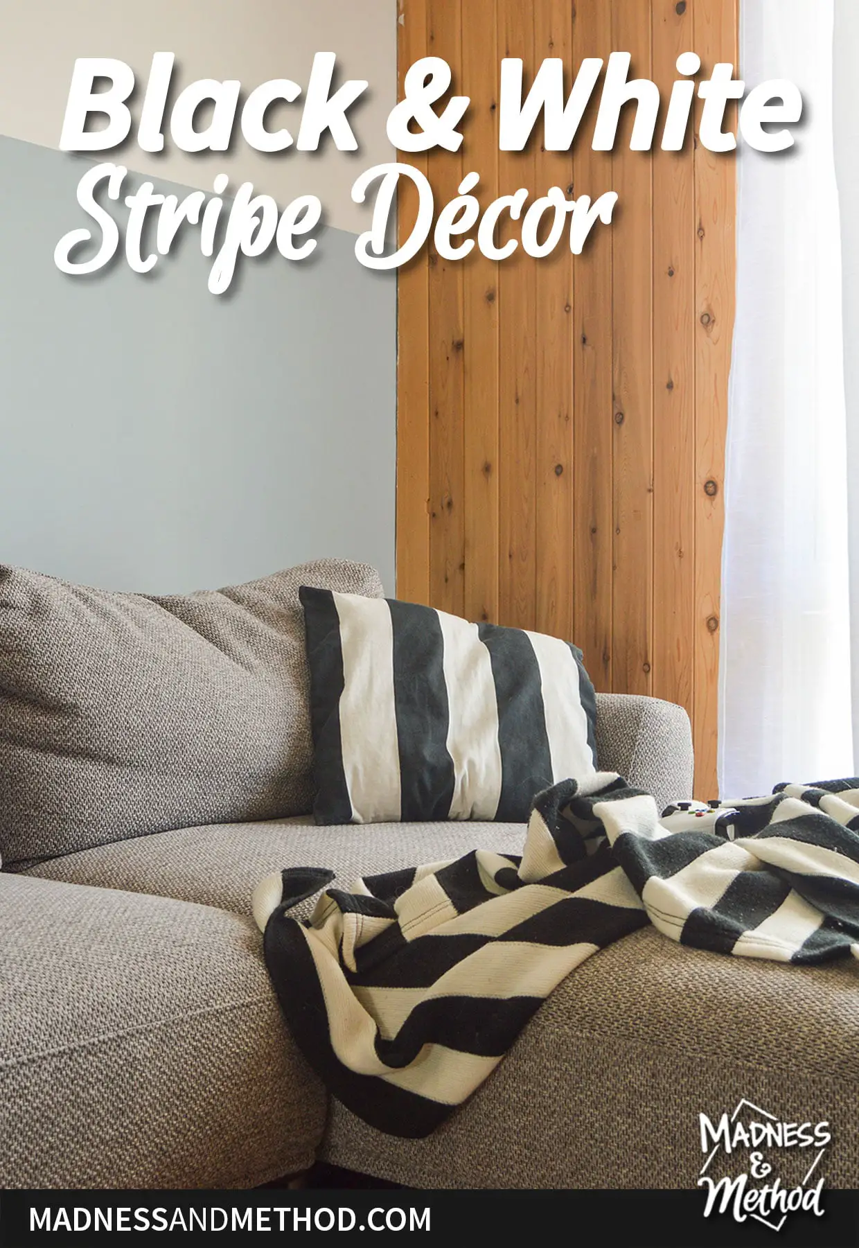black white striped pillow and blanket on gray couch corner