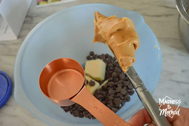 measuring cup and peanut butter