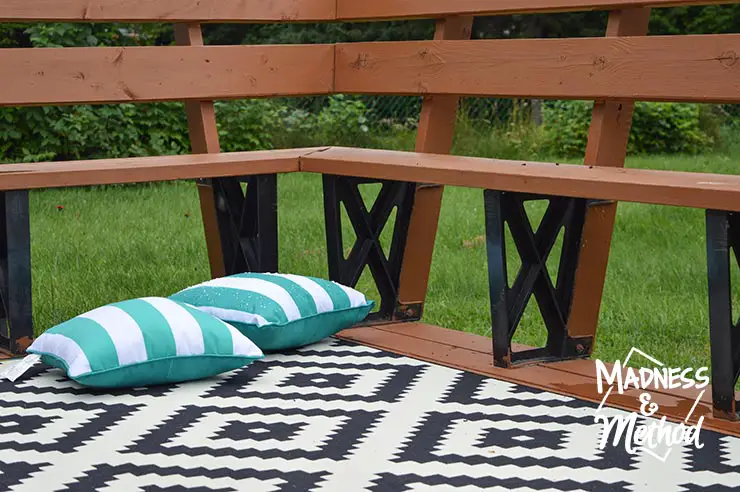 month of august outdoor image with rug and pillows