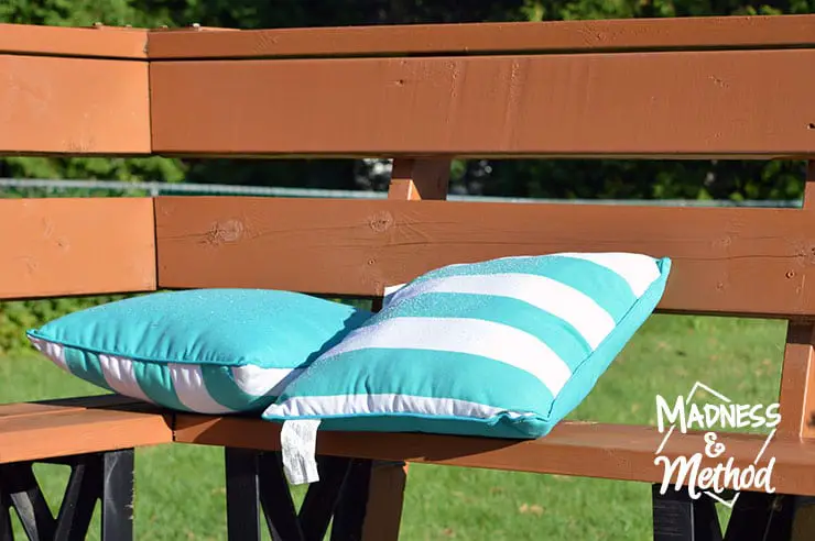 month of september outdoor shot of pillows on deck bench