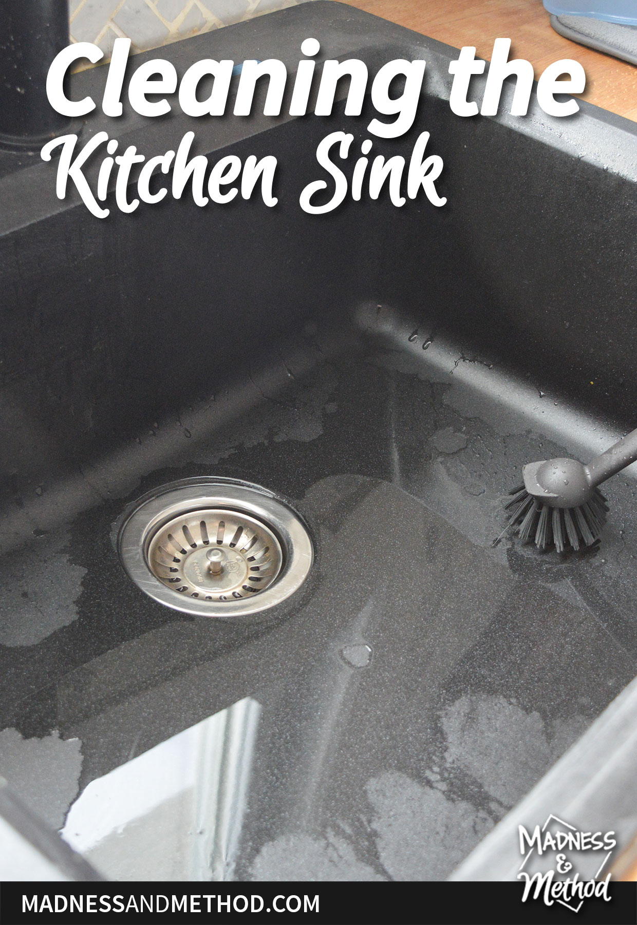 cleaning the kitchen sink text overlay on black wet sink