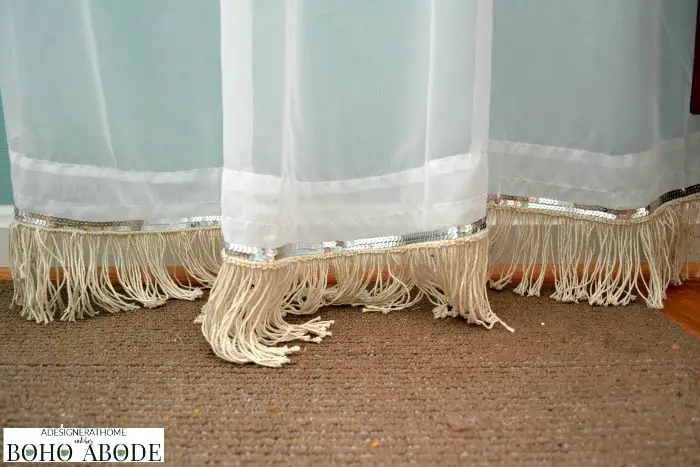 white sheer curtains with beige fringe