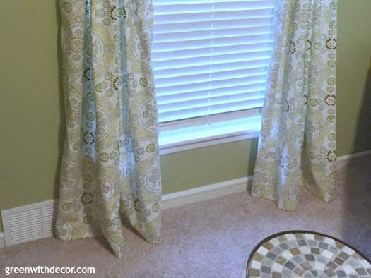 green walls green curtains in front of window