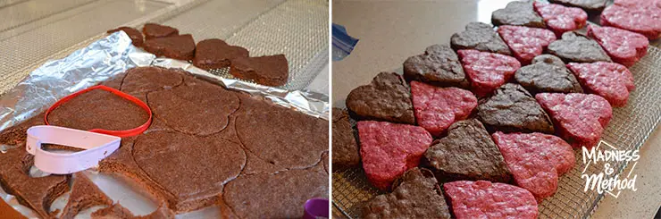 thin brownies on tinfoil with heart shaped cookie cutters and cut out heart-shaped brownies