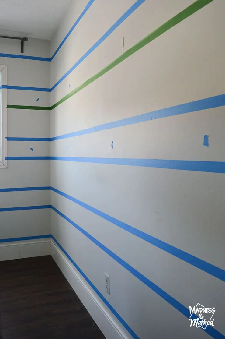 painters tape wrapped around corner of white wall room