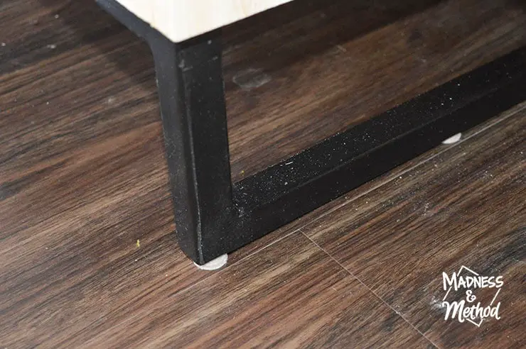 close-up of black metal stand for ikea kallax