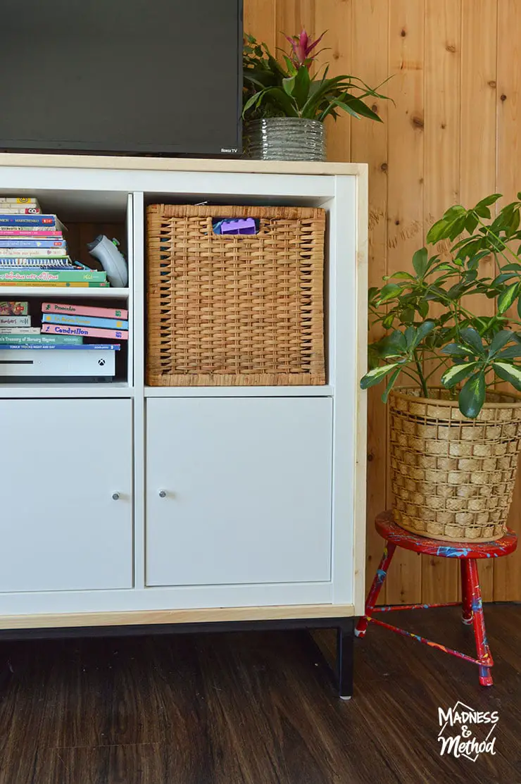 white ikea kallax cabinet with basket