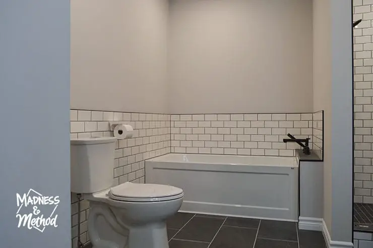 black floor bathroom white tile walls