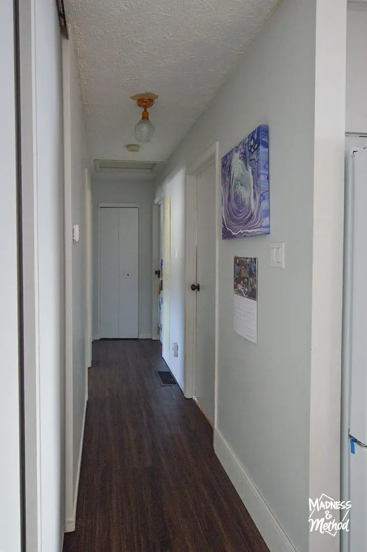 raised ranch hallway with white walls and ceiling