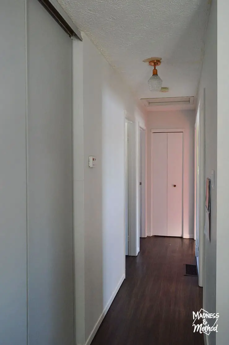 white hallway with glow from bedrooms