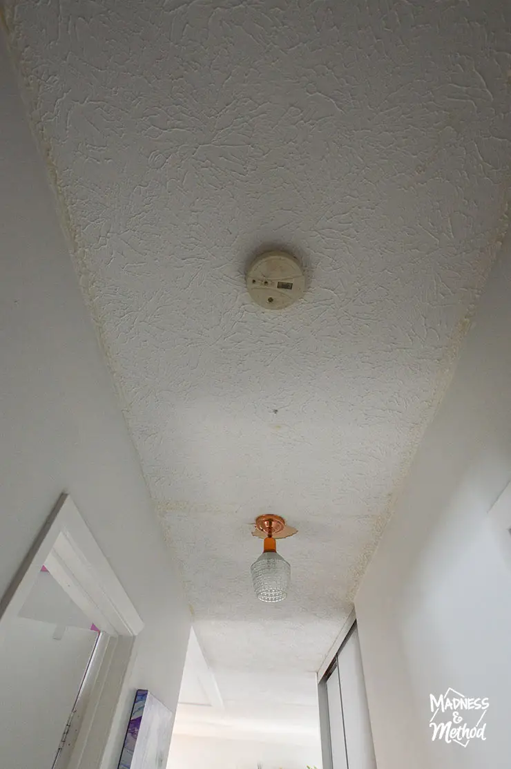 white stucco ceiling with smoke detector