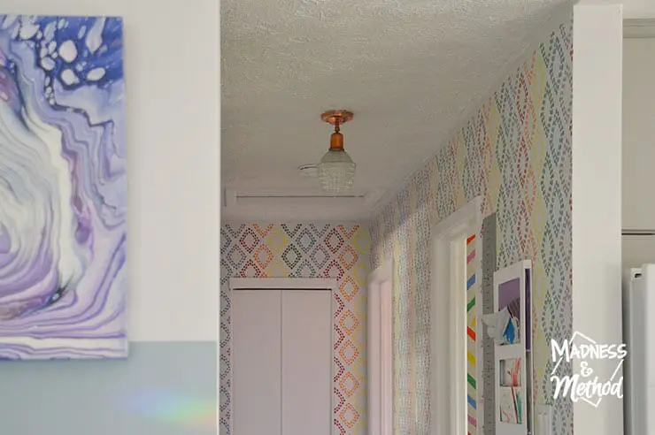white popcorn ceiling with rainbow walls