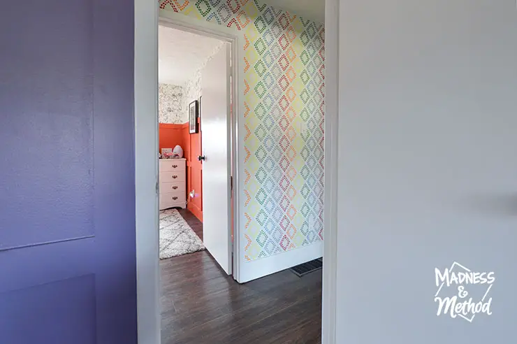 colourful bedrooms into white hallway