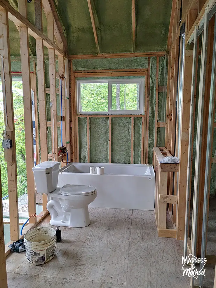 bathroom framing with tub and toilet