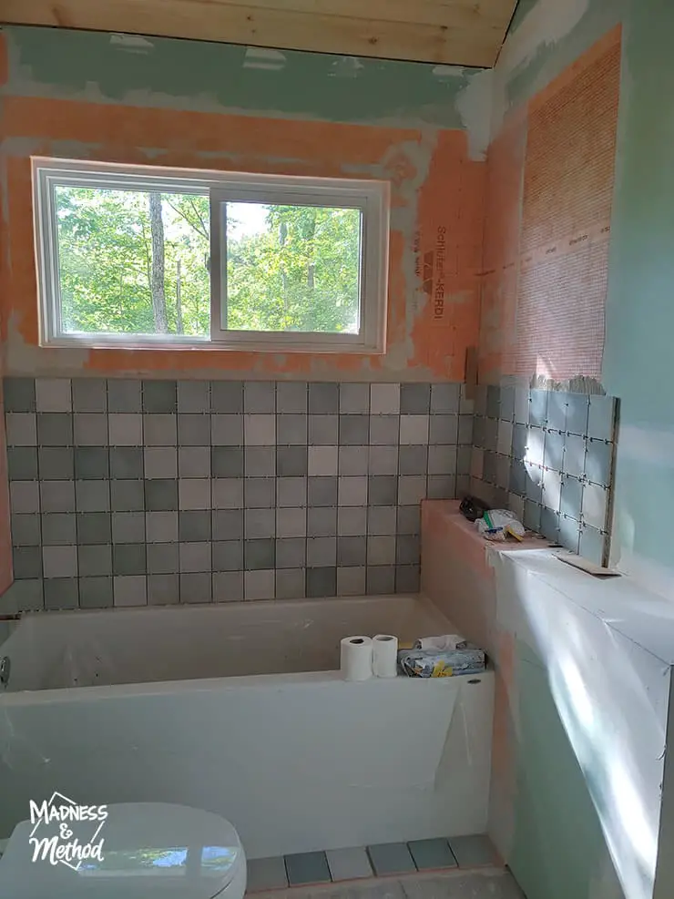 tiling progress in bathroom tub