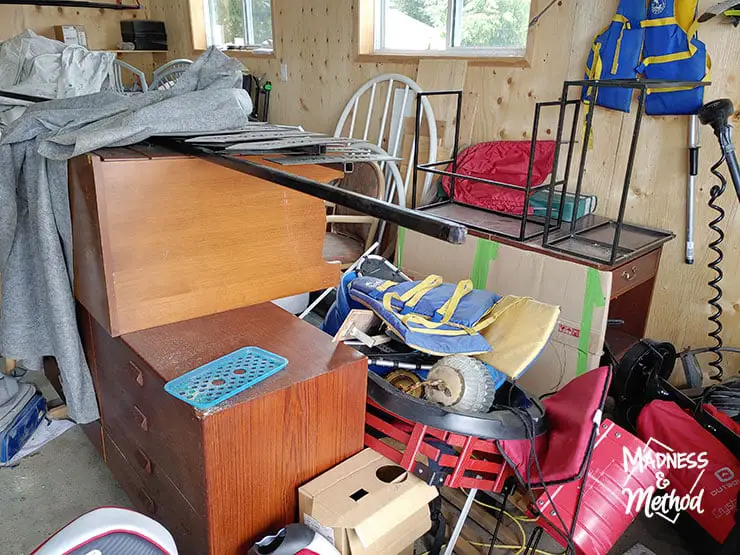 messy garage with dressers