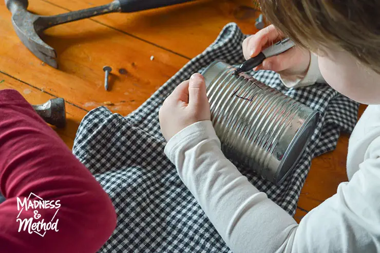 drawing on tin can lanterns