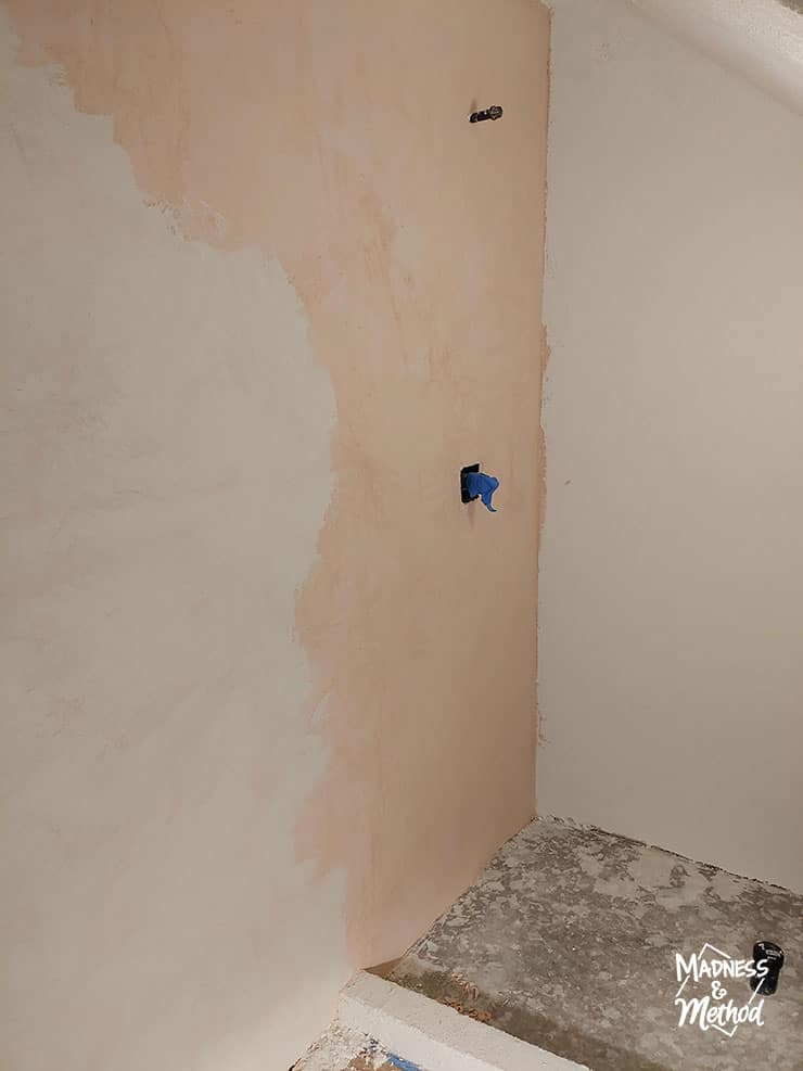 white microcement over peach