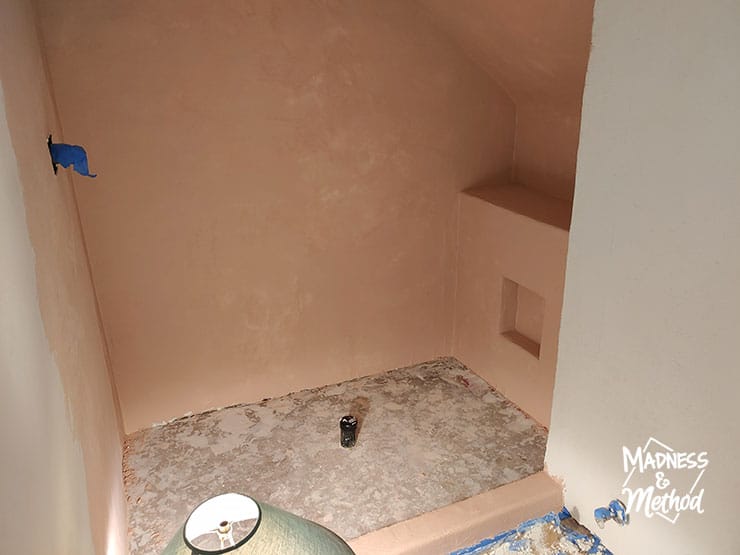 peach microcement walls in shower