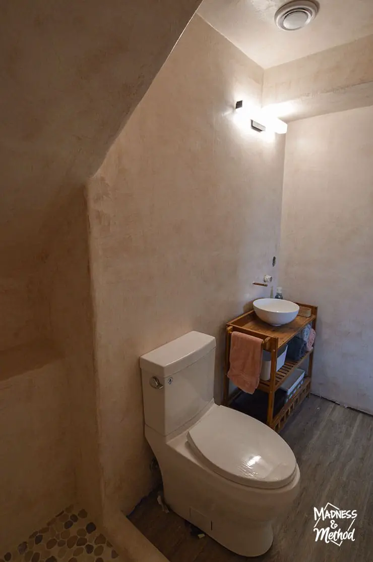 small basement bathroom under stairs