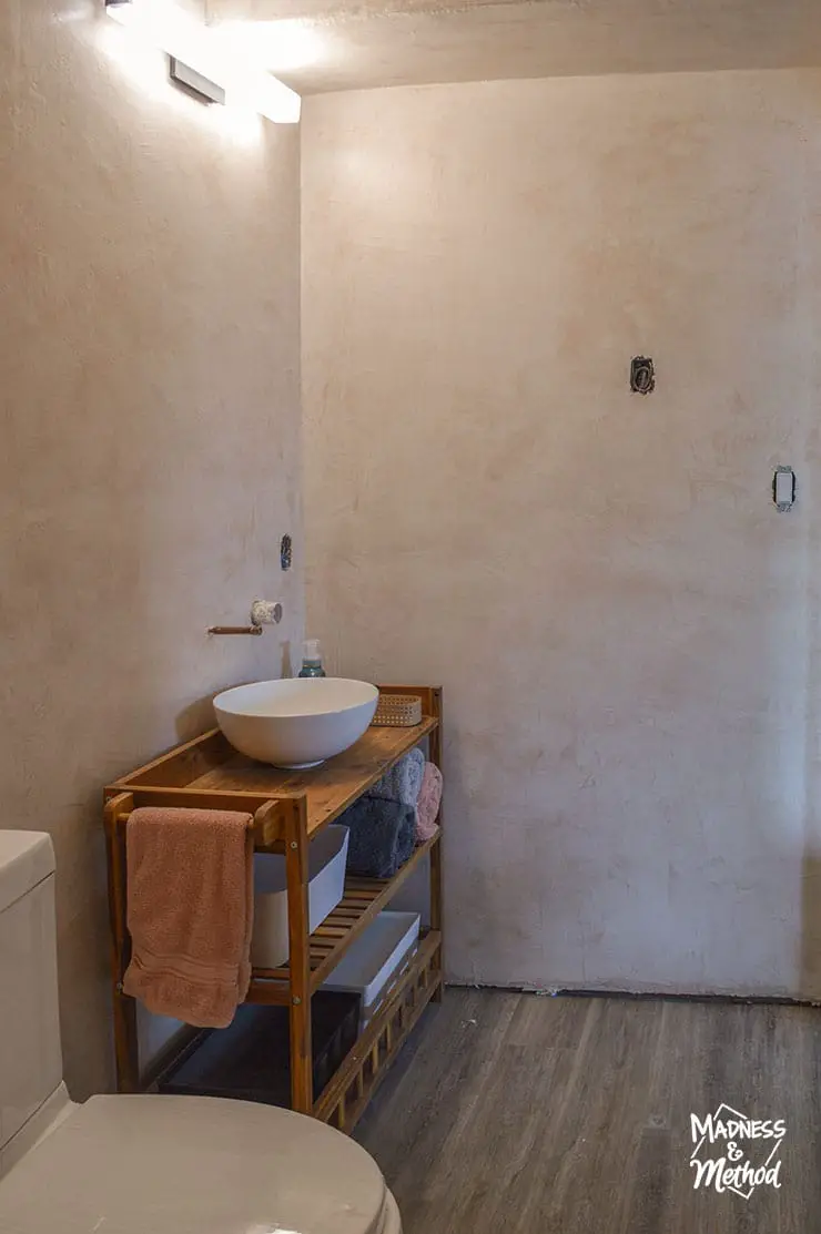 microcement walls in unfinished bathroom