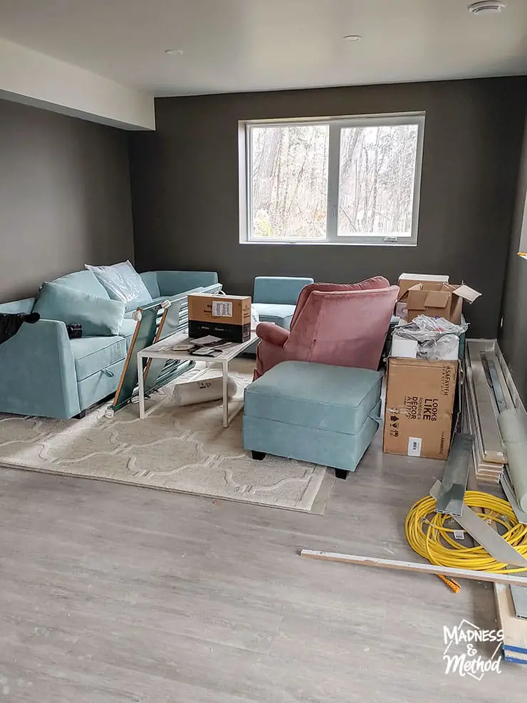 unfinished basement living room dark walls