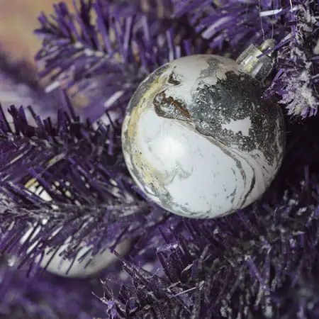 marble ornament on purple christmas tree