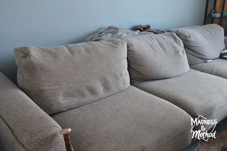 fluffing cushions on sofa sectional