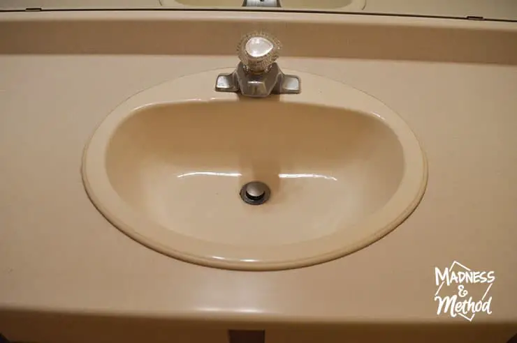 almond sink with old faucet