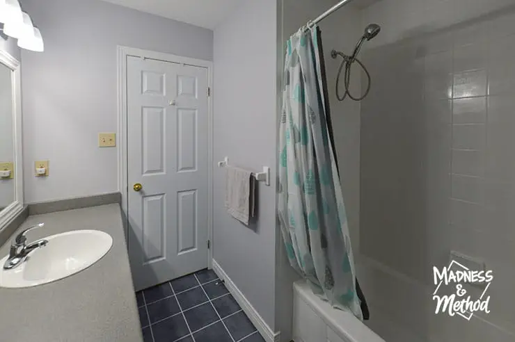 gray bathroom white door