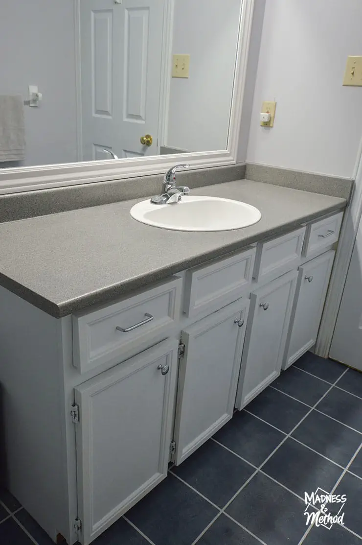 white vanity with gray counters