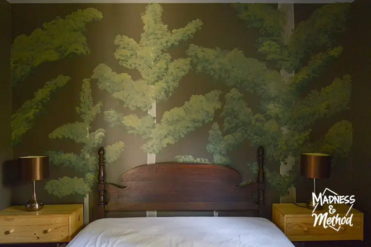 painted forest mural in bedroom
