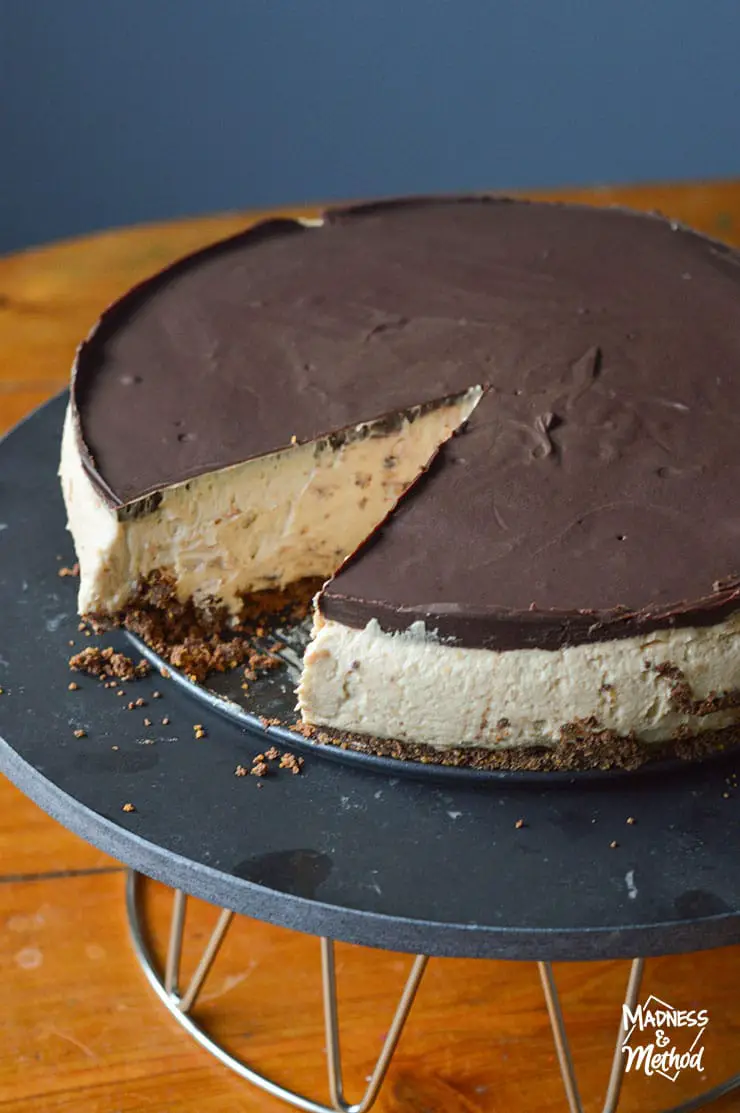 slice cut from peanut butter chocolate cheesecake