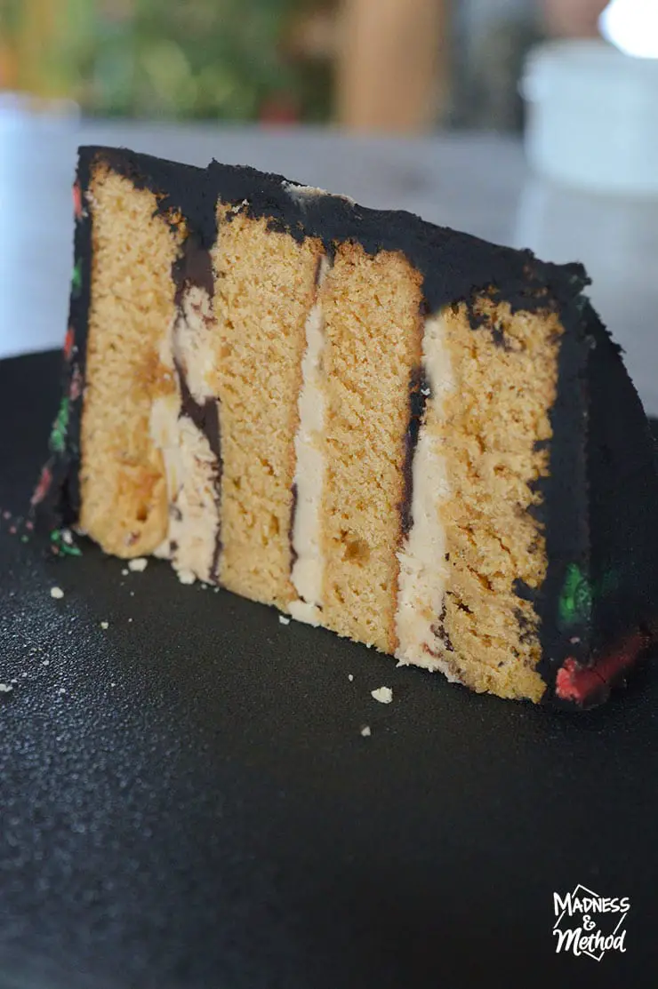 four layer caramel cake with black plate