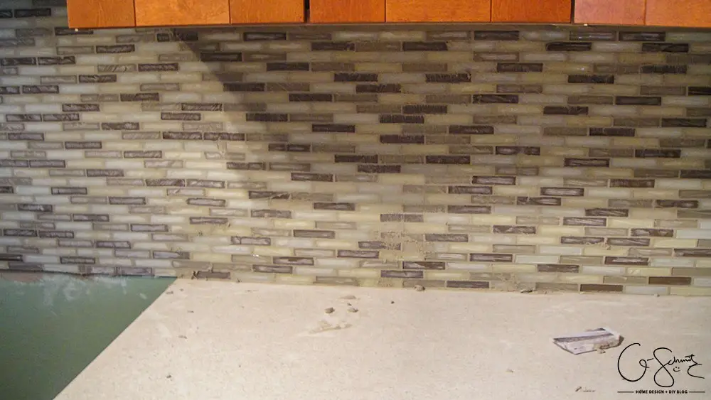 How to lay & prep tiles for a finished kitchen backsplash. These easy to follow DIY instructions will help you better plan the layout for your backsplash!