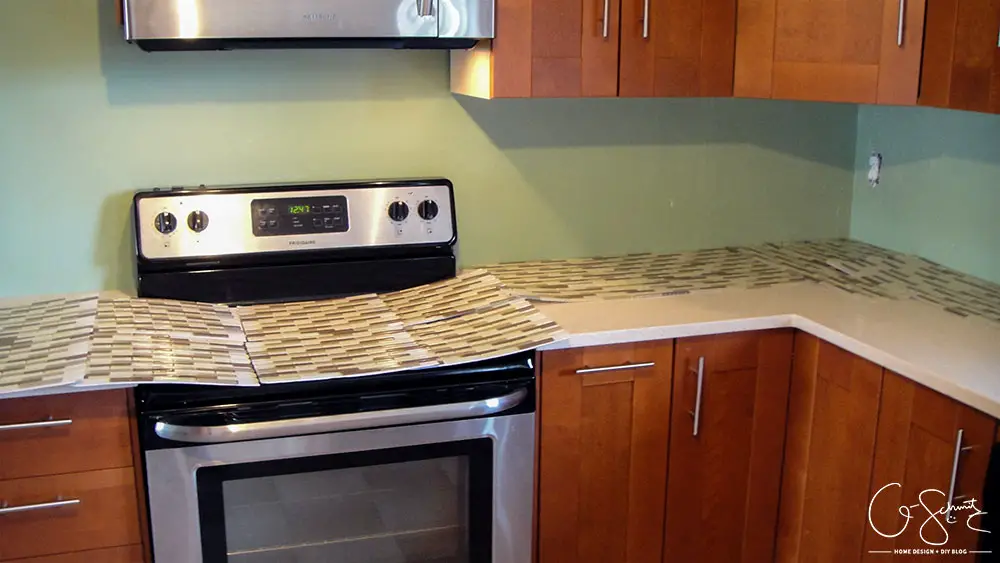 How to lay & prep tiles for a finished kitchen backsplash. These easy to follow DIY instructions will help you better plan the layout for your backsplash!