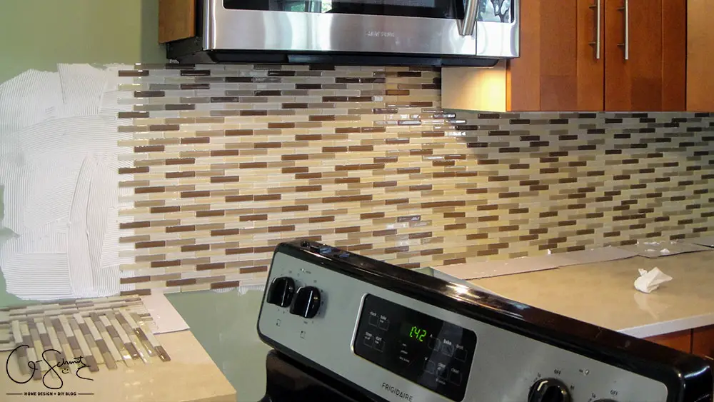 How to lay & prep tiles for a finished kitchen backsplash. These easy to follow DIY instructions will help you better plan the layout for your backsplash!