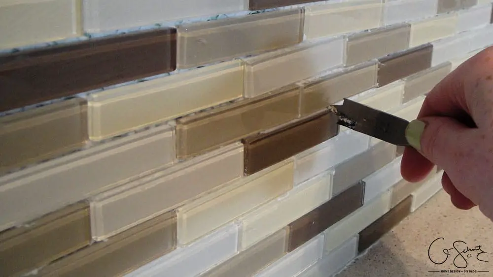 How to lay & prep tiles for a finished kitchen backsplash. These easy to follow DIY instructions will help you better plan the layout for your backsplash!