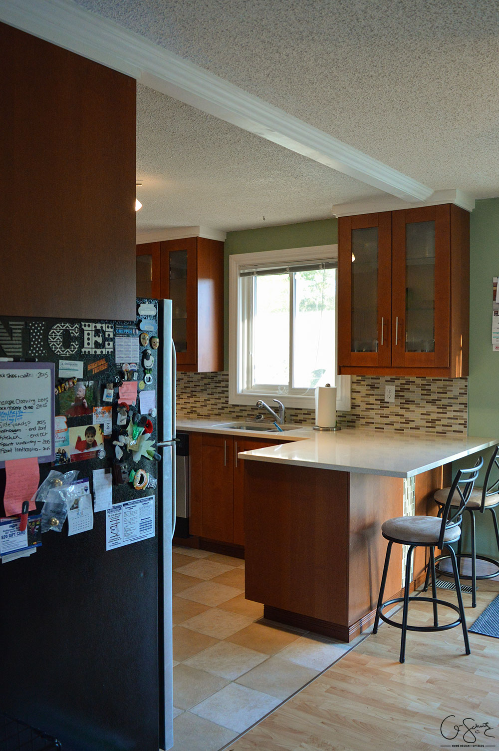 The before and after photo reveal of our DIY kitchen renovation. Check out all the great features we added to make this space unique. I can’t believe what it used to look like!