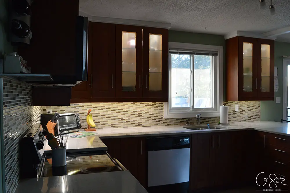 The before and after photo reveal of our DIY kitchen renovation. Check out all the great features we added to make this space unique. I can’t believe what it used to look like!