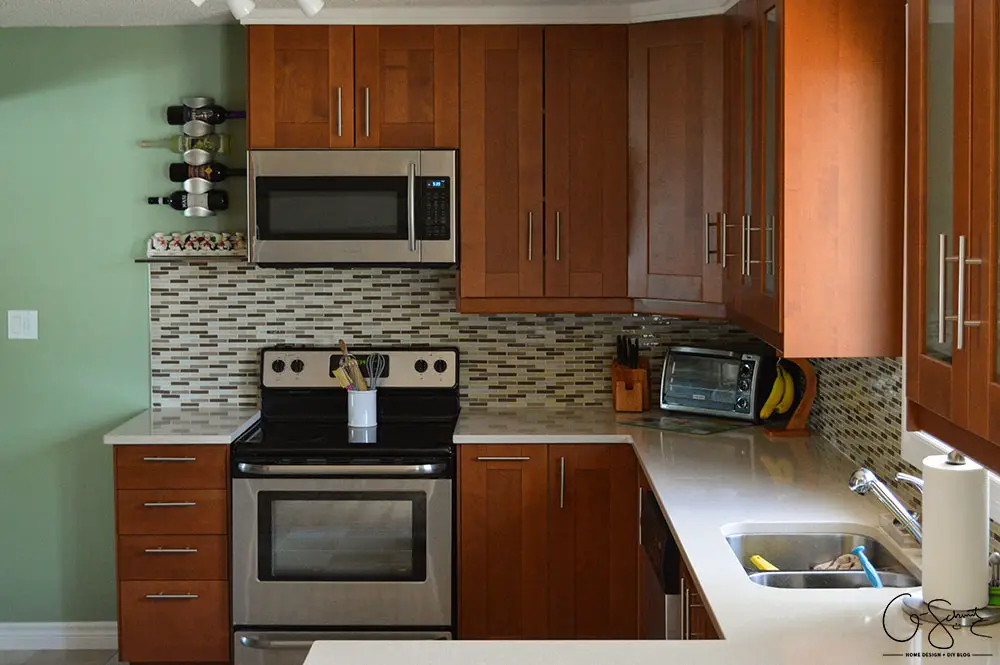 The before and after photo reveal of our DIY kitchen renovation. Check out all the great features we added to make this space unique. I can’t believe what it used to look like!