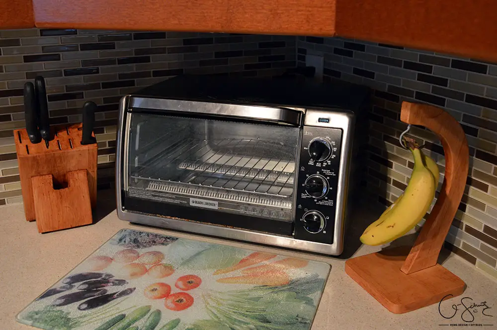 How to easily stain your wooden kitchen accessories and kitchenware to match your cabinets (helps to create a nice cohesive design). Great tips for other staining projects as well!