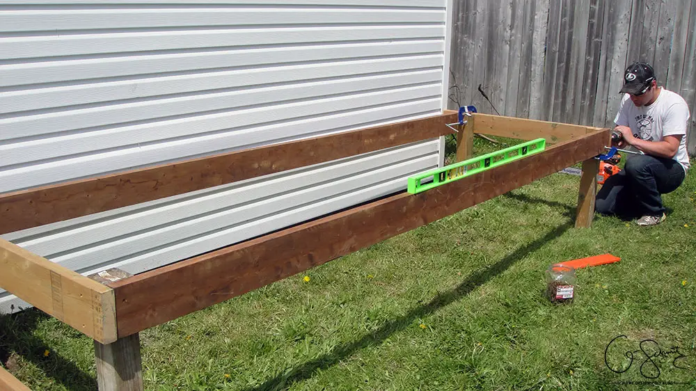 Looking for a DIY build project to kick-start your summer gardening? Here are some easy to follow instructions for building a raised garden bed along a shed (or fence, or whatever!) that you can easily adapt to your space.