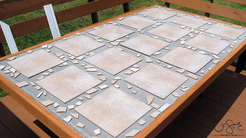 Did your glass patio tabletop break and you’re looking to make a new top? Here’s a super-duper custom patio table that I made using lots of leftover materials. It’s an easy DIY project that can be almost completely customized to anything you want!