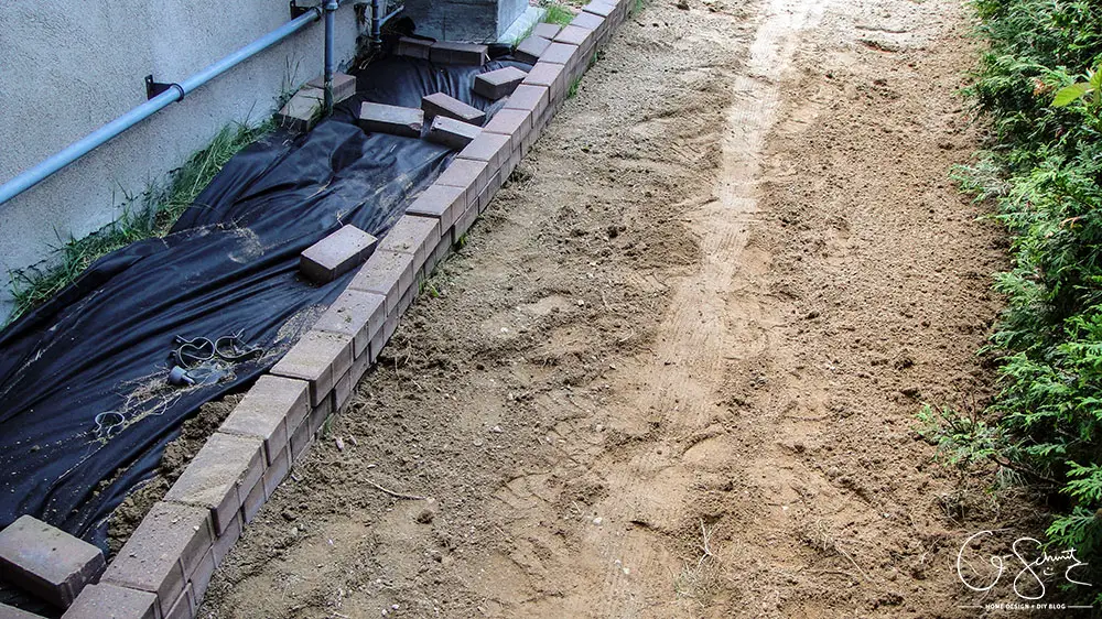 To tackle side yard landscaping (or any area really), the first step is often levelling the ground and prepping the area for what will be going on top (whether it’s pavers, stones, grass, etc!). 