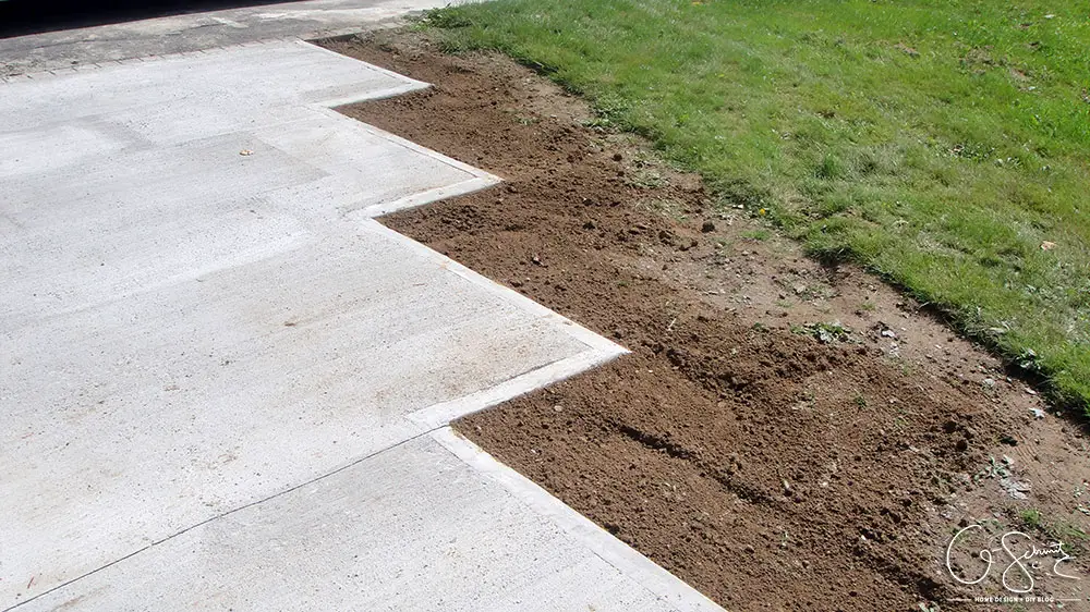 Now that the DIY concrete walkway is in, we just have to do a tiny bit more landscaping and beautification before I can complete this project walkway. Check out the great before and after photos to see all the work we did this summer! 