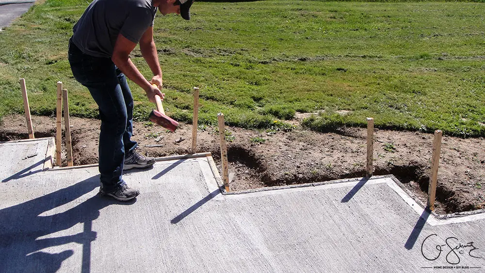 Our project walkway is almost complete now that the DIY concrete is set. Check out the pictures of how it looks currently and read my pros and cons of going with a DIY walkway versus professional concrete.