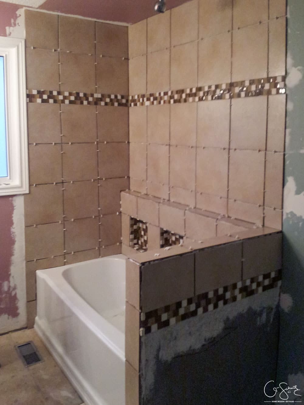 Here are the before pictures of our main DIY bathroom renovation... complete with pink walls, enclosed toilet niche and a full/drywall linen closet!